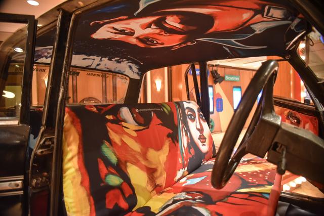 The team of Taxi Fabric pasting posters on to the interiors of a taxi (Photo: taxi fabric) The team of Taxi Fabric pasting posters on to the interiors of a taxi (Photo: taxi fabric)