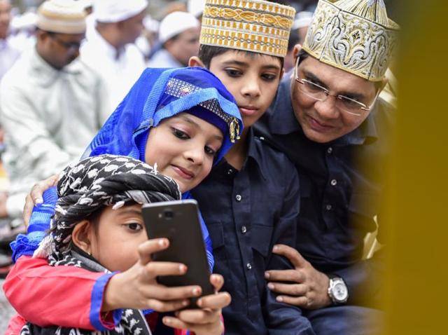 It is the selfie time for a family after offering Eid-ul-Fitr ‘namaz’ at the Bandra station on Thursday. (Kunal Patil)