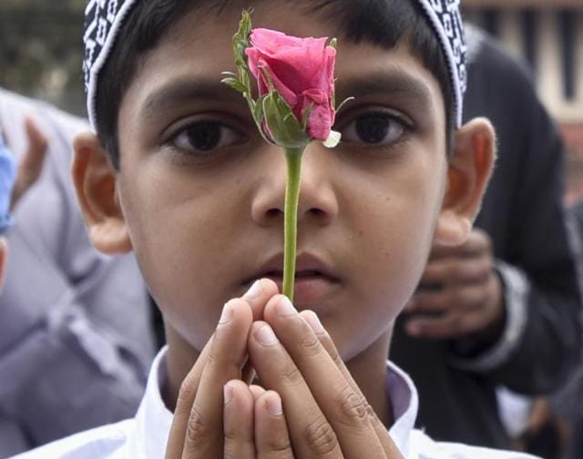 A child offers ‘namaz’ at the the Bandra station in Mumbai on Thursday. (Kunal Patil)