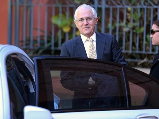 A security official assists Australian Prime Minister Malcolm Turnbull get into a car outside his home in Sydney. (Reuters) A security official assists Australian Prime Minister Malcolm Turnbull get into a car outside his home in Sydney. (Reuters)