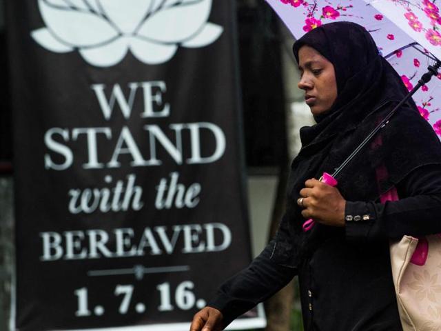 A woman walks past a banner that reads "We stand with the bereaved" in a street near an upscale restaurant which was the site of a bloody siege that ended in the death of 22 peopl, in Dhaka on July 5, 2016. Suspected militants attacked a congregation gathered in a mosque in Kishoregunj town on July 7.(AFP) A woman walks past a banner that reads "We stand with the bereaved" in a street near an upscale restaurant which was the site of a bloody siege that ended in the death of 22 peopl, in Dhaka on July 5, 2016. Suspected militants attacked a congregation gathered in a mosque in Kishoregunj town on July 7.(AFP)