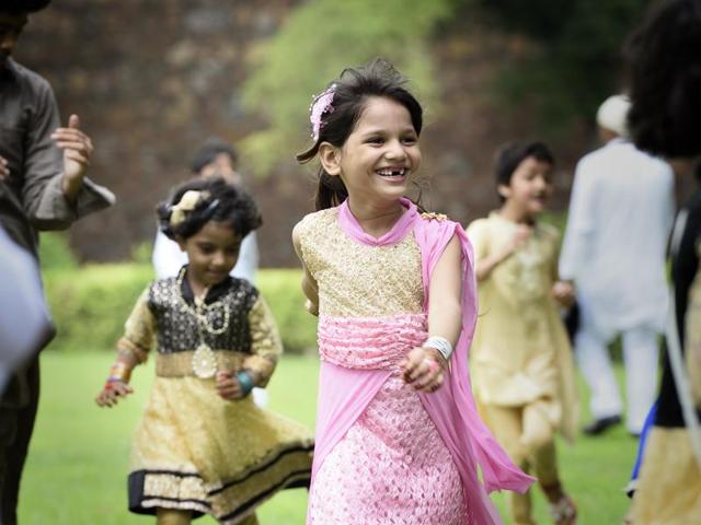 Children play as Muslims observe Eid Al Fitr with prayers at the Ferozshah Kotla mosque complex. (Gurinder Osan/HT PHOTO)