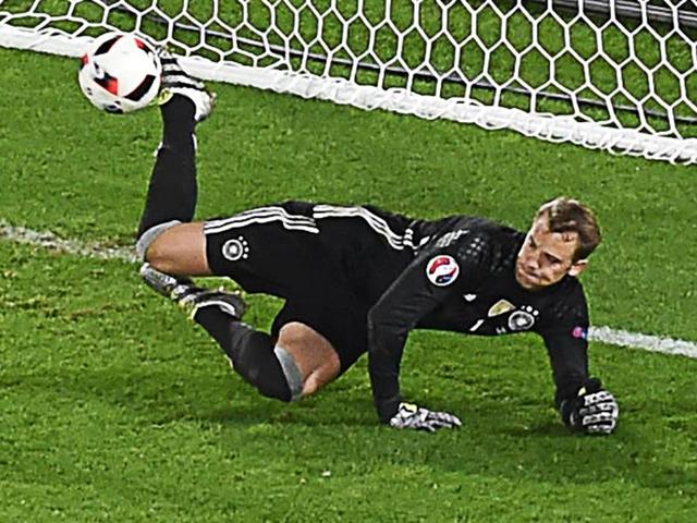 Germany's goalkeeper Manuel Neuer stops the ball during a penalty shootout of the Euro 2016 quarterfinal football match between Germany and Italy at the Matmut Atlantique stadium in Bordeaux. (AFP Photo) Germany's goalkeeper Manuel Neuer stops the ball during a penalty shootout of the Euro 2016 quarterfinal football match between Germany and Italy at the Matmut Atlantique stadium in Bordeaux. (AFP Photo)