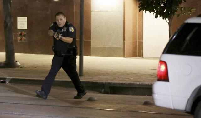 Police said one suspect they had engaged in a shootout had been arrested, and a bomb squad unit was investigating a suspicious package found near the suspect’s location. (AP Photo)