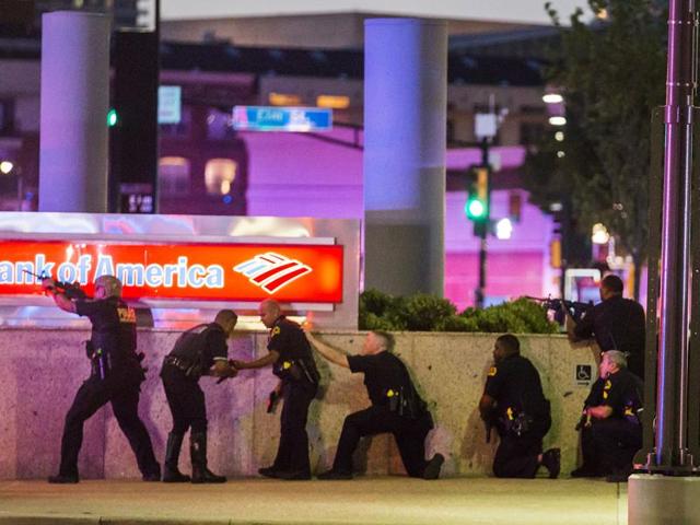 The police were combing downtown for what they believed was a bomb planted by the snipers as the heart of the country’s ninth-largest city was put on lockdown. (AP Photo)