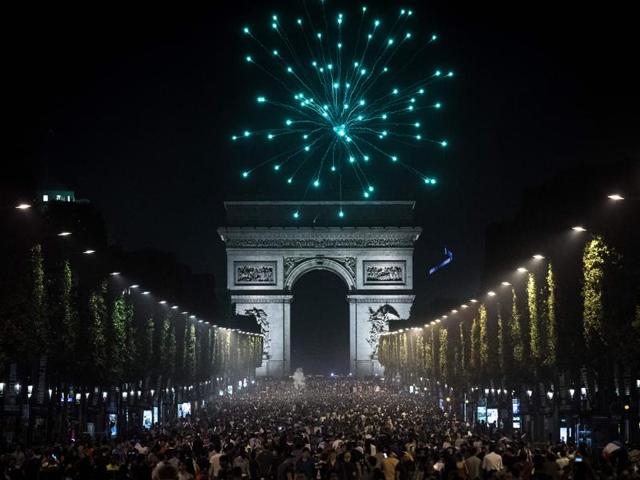 Supporters celebrate after France won the Euro 2016 semifinal football match against Germany, on the Avenue des Champs-Elysees in Paris. France will face Portugal in the Euro 2016 finals on July 10. (AFP Photo) Supporters celebrate after France won the Euro 2016 semifinal football match against Germany, on the Avenue des Champs-Elysees in Paris. France will face Portugal in the Euro 2016 finals on July 10. (AFP Photo)