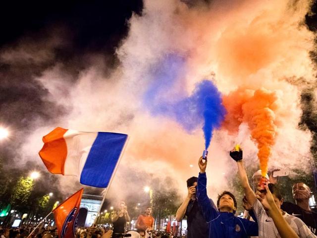 France supporters celebrate with smoke flares after France won the Euro 2016 semifinal. (AFP Photo) France supporters celebrate with smoke flares after France won the Euro 2016 semifinal. (AFP Photo)