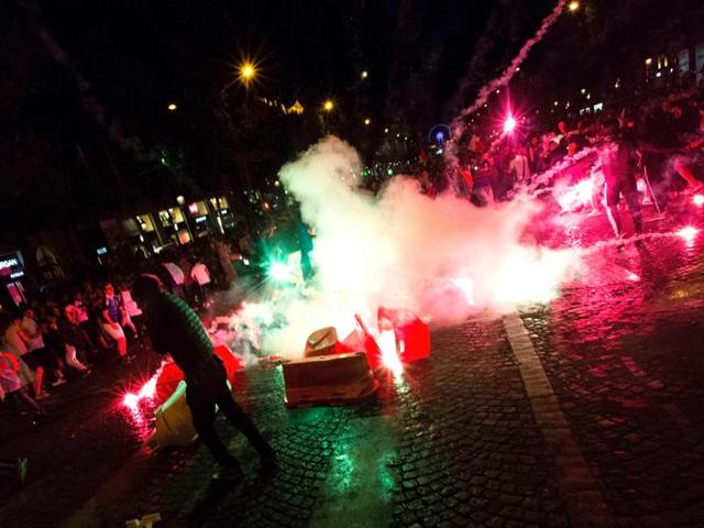 France supporters celebrate with smoke flares after France won the Euro 2016 semifinal. (AFP Photo) France supporters celebrate with smoke flares after France won the Euro 2016 semifinal. (AFP Photo)