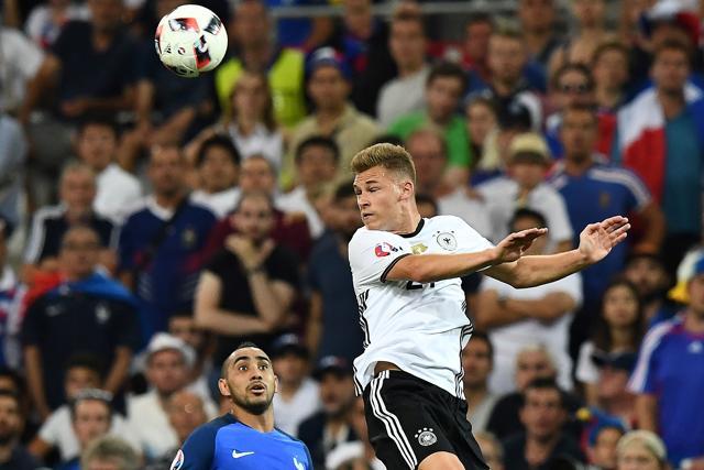 France's forward Dimitri Payet (left) eyes the header by Germany's midfielder Joshua Kimmich during the Euro 2016 semifinal football match between Germany and France. (AFP Photo) France's forward Dimitri Payet (left) eyes the header by Germany's midfielder Joshua Kimmich during the Euro 2016 semifinal football match between Germany and France. (AFP Photo)