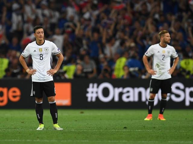 Germany's Mesut Ozil (left) and Shkodran Mustafi react after France's forward Antoine Griezmann (unseen) scores the second goal for France. (AFP Photo) Germany's Mesut Ozil (left) and Shkodran Mustafi react after France's forward Antoine Griezmann (unseen) scores the second goal for France. (AFP Photo)