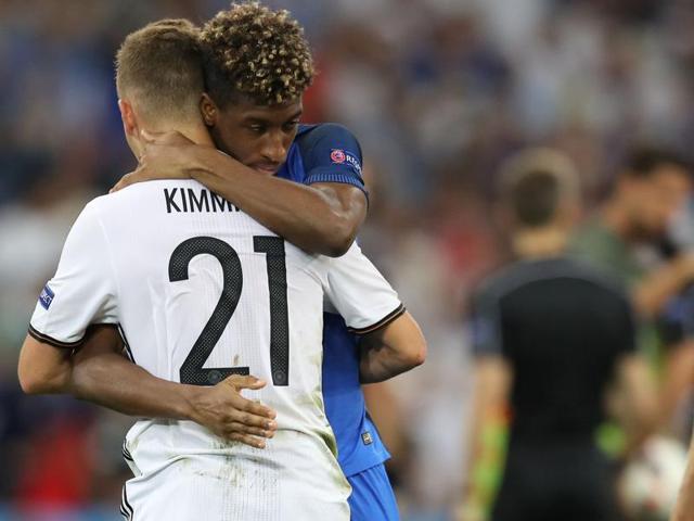 France's forward Kingsley Coman (second left) hugs German midfielder Joshua Kimmich (left) after the Euro 2016 semifinal football match at the Stade Velodrome in Marseille. (AFP Photo) France's forward Kingsley Coman (second left) hugs German midfielder Joshua Kimmich (left) after the Euro 2016 semifinal football match at the Stade Velodrome in Marseille. (AFP Photo)