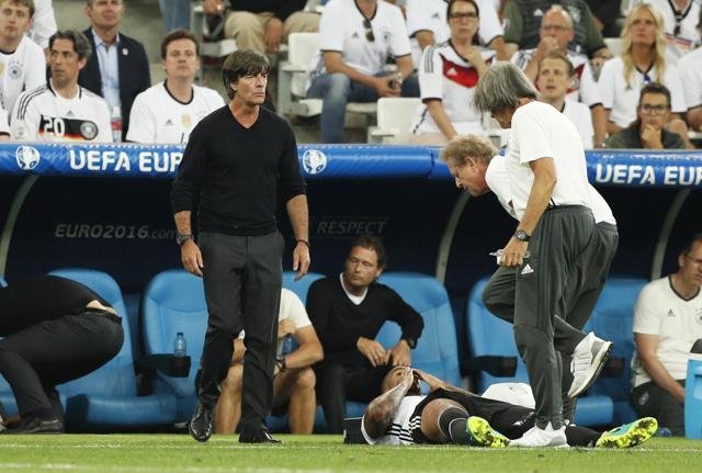 Germany's Jerome Boateng receives treatment after sustaining an injury before being substituted as head coach Joachim Low looks on. (Reuters Photo) Germany's Jerome Boateng receives treatment after sustaining an injury before being substituted as head coach Joachim Low looks on. (Reuters Photo)