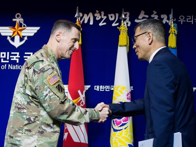 South Korean defence ministry's deputy minister Yoo Jeh-seung (right) shakes hands with the commander of US Forces Korea's Eighth Army, Lt Gen Thomas Vandal, after a news conference about deploying the Terminal High Altitude Area Defense (THAAD) anti-missile system on Friday. (Reuters) South Korean defence ministry's deputy minister Yoo Jeh-seung (right) shakes hands with the commander of US Forces Korea's Eighth Army, Lt Gen Thomas Vandal, after a news conference about deploying the Terminal High Altitude Area Defense (THAAD) anti-missile system on Friday. (Reuters)