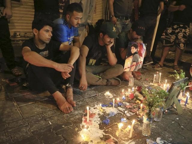 Iraqis gather at the scene of Sunday's truck bombing in the Karada neighborhood, Baghdad, Iraq, Thursday, July 7, 2016. An IS-claimed suicide bombing on July 3, 2016, killed 292 people in the capital. (AP) Iraqis gather at the scene of Sunday's truck bombing in the Karada neighborhood, Baghdad, Iraq, Thursday, July 7, 2016. An IS-claimed suicide bombing on July 3, 2016, killed 292 people in the capital. (AP)