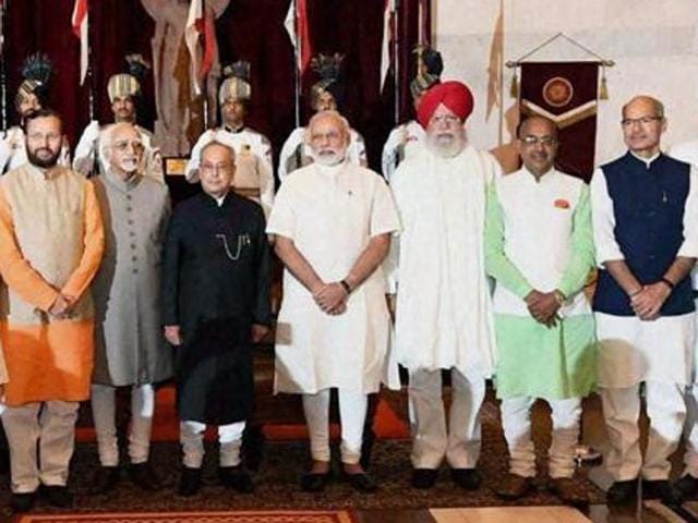 Prime Minister Narendra Modi, talks to BJP national president Amit Shah, and Union home minister Rajnath Singh at the swearing-in ceremony of his new ministers at the Rashtrpati Bhawan in New Delhi on July 5. Modi revamped his cabinet bringing in 19 new junior ministers to speed up decision-making and delivery on promises made in this year's budget. (Sonu Mehta/ HT Photo) Prime Minister Narendra Modi, talks to BJP national president Amit Shah, and Union home minister Rajnath Singh at the swearing-in ceremony of his new ministers at the Rashtrpati Bhawan in New Delhi on July 5. Modi revamped his cabinet bringing in 19 new junior ministers to speed up decision-making and delivery on promises made in this year's budget. (Sonu Mehta/ HT Photo)