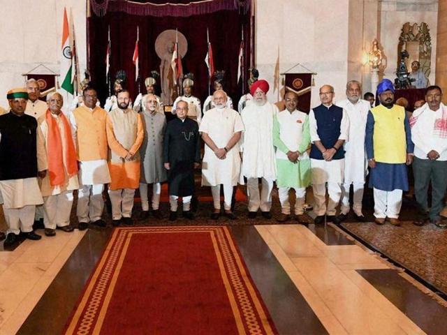 Newly indicted ministers with Prime Minister Narendra Modi, vice-president Hamid Ansari and President Pranab Mukherjee after a swearing-in ceremony at the Rashtrapati Bhavan on Tuesday. (PTI Photo) Newly indicted ministers with Prime Minister Narendra Modi, vice-president Hamid Ansari and President Pranab Mukherjee after a swearing-in ceremony at the Rashtrapati Bhavan on Tuesday. (PTI Photo)