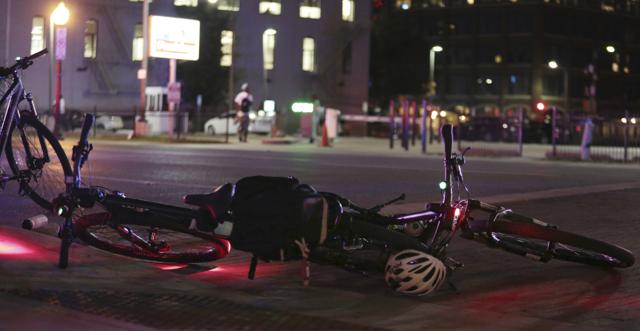 Videos of the scene circulated widely on social media. In many of them, multiple gunshots could be heard ringing out in a city illuminated by police lights. (AP Photo)