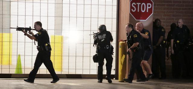Dallas police respond after shots were fired during a protest over recent fatal shootings by police in Louisiana and Minnesota. (AP Photo)
