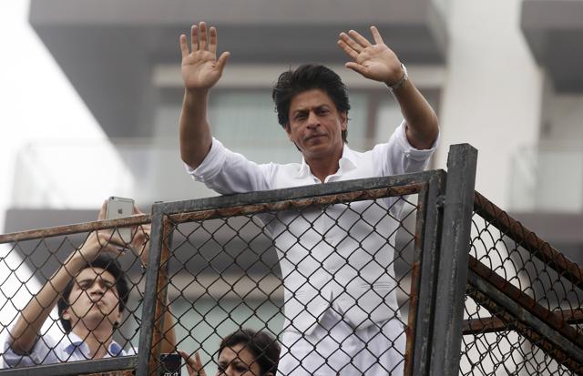 Shah Rukh Khan greets fans waiting outside his residence on Eid al-Fitr in Mumbai on July 7, 2016. (AP) Shah Rukh Khan greets fans waiting outside his residence on Eid al-Fitr in Mumbai on July 7, 2016. (AP)