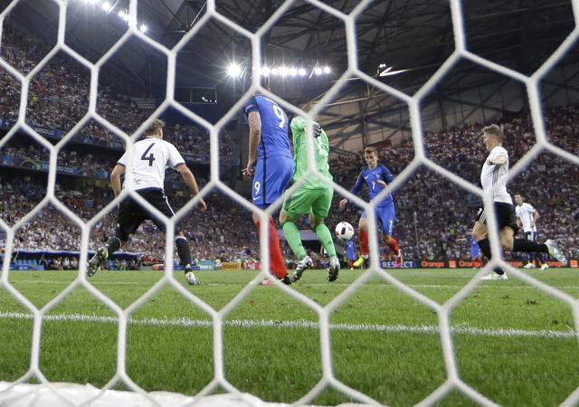 France's Antoine Griezmann (third from right) scores his second goal during the Euro 2016 semifinal match between Germany and France, at the Velodrome stadium in Marseille. (AP Photo) France's Antoine Griezmann (third from right) scores his second goal during the Euro 2016 semifinal match between Germany and France, at the Velodrome stadium in Marseille. (AP Photo)