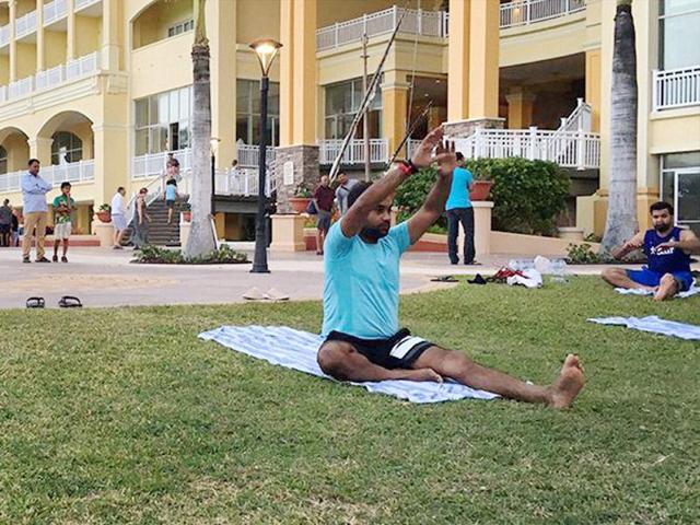 Team India players taking part in an outdoor yoga session in St Kitts in West Indies. (PTI) Team India players taking part in an outdoor yoga session in St Kitts in West Indies. (PTI)