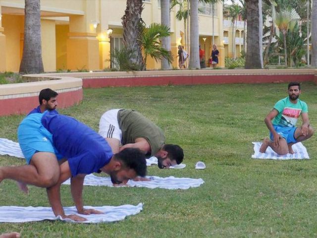 Team India players taking part in an outdoor yoga session in St Kitts in West Indies. (PTI) Team India players taking part in an outdoor yoga session in St Kitts in West Indies. (PTI)