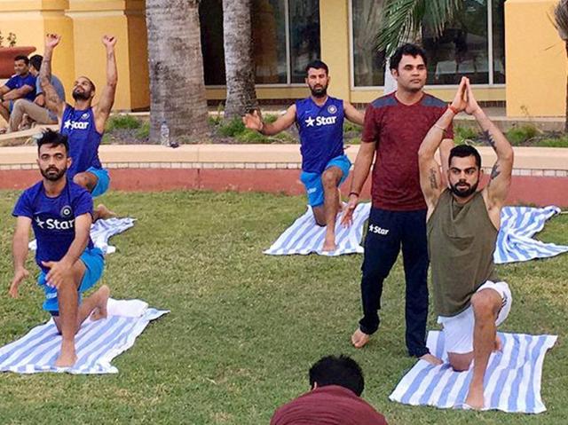 Skipper Virat Kohli with teammates Ajinkya Rahane, Cheteshwar Pujara and Shikhar Dhawan taking part in an outdoor yoga session. (PTI) Skipper Virat Kohli with teammates Ajinkya Rahane, Cheteshwar Pujara and Shikhar Dhawan taking part in an outdoor yoga session. (PTI)