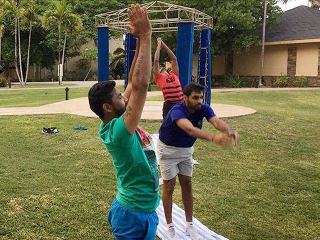 Team India players taking part in an outdoor yoga session in St Kitts. (PTI) Team India players taking part in an outdoor yoga session in St Kitts. (PTI)