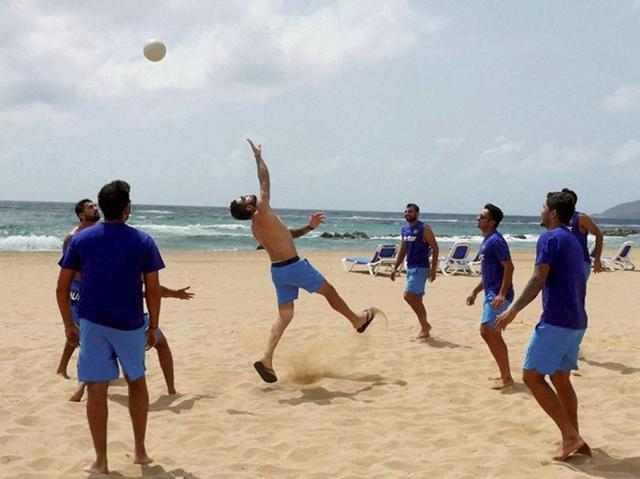 Team India members rejuvenate themselves with beach volleyball in St Kitts in West Indies on Friday. (PTI) Team India members rejuvenate themselves with beach volleyball in St Kitts in West Indies on Friday. (PTI)
