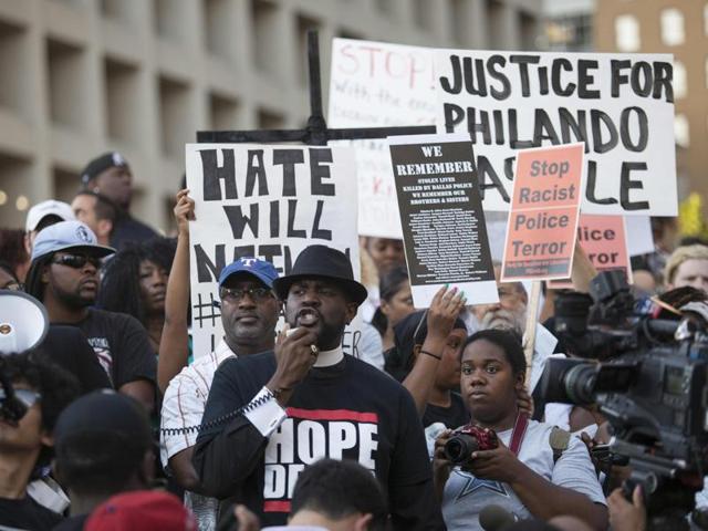 People rally in Dallas, Texas, on Thursday, July 7, 2016 to protest the deaths of Alton Sterling and Philando Castile. (AFP) People rally in Dallas, Texas, on Thursday, July 7, 2016 to protest the deaths of Alton Sterling and Philando Castile. (AFP)