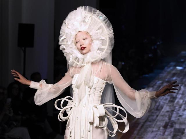 Jean Paul Gaultier: Jean Paul Gaultier drew inspiration from nature and from Japan for his latest haute couture collection, treating the audience to a Zen-filled ambiance. The designer’s collection included some original headgear, which framed models’ faces. (AFP) Jean Paul Gaultier: Jean Paul Gaultier drew inspiration from nature and from Japan for his latest haute couture collection, treating the audience to a Zen-filled ambiance. The designer’s collection included some original headgear, which framed models’ faces. (AFP)