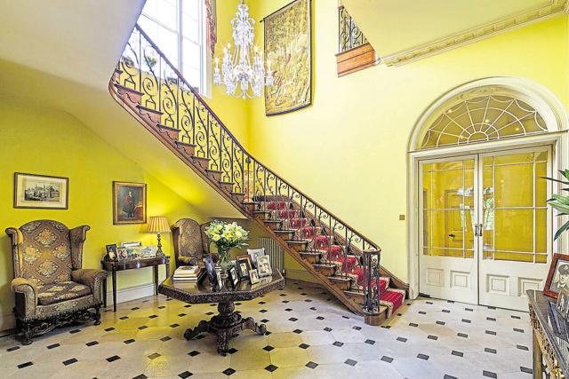 A grand staircase leading from the lobby to the rooms upstairs. A grand staircase leading from the lobby to the rooms upstairs.
