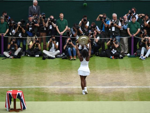 Serena Williams poses for photographs with the Venus Rosewater Dish. (AP) Serena Williams poses for photographs with the Venus Rosewater Dish. (AP)
