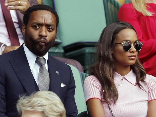 Actor Chiwetel Ejiofor and his girlfriend Frances Aaternir watch as Andy Murray plays Tomas Berdych. (AP) 