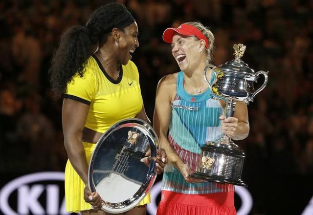 Germany’s Angelique Kerber (right) laughs with Serena Williams as she holds the trophy after winning their final match at the Australian Open tennis tournament at Melbourne Park, Australia. (Reuters File) Germany’s Angelique Kerber (right) laughs with Serena Williams as she holds the trophy after winning their final match at the Australian Open tennis tournament at Melbourne Park, Australia. (Reuters File)