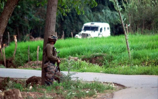 A soldier takes guard near the site where Hizbul Mujahideen militant commander Burhan Wani and two of his associates were killed in Anantnag district of south Kashmir on Friday. (PTI Photo) A soldier takes guard near the site where Hizbul Mujahideen militant commander Burhan Wani and two of his associates were killed in Anantnag district of south Kashmir on Friday. (PTI Photo)