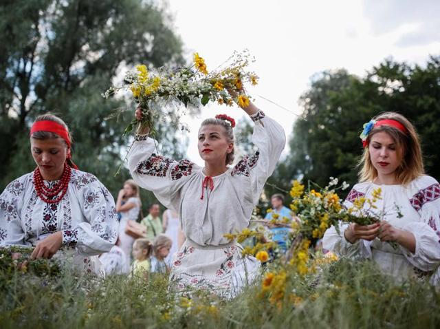 Women make wreaths during Ivana Kupala. (REUTERS) Women make wreaths during Ivana Kupala. (REUTERS)