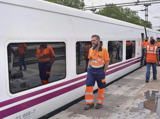 Railway personnel check Spanish Talgo railway coaches at Mathura railway station. (PTI) Railway personnel check Spanish Talgo railway coaches at Mathura railway station. (PTI)