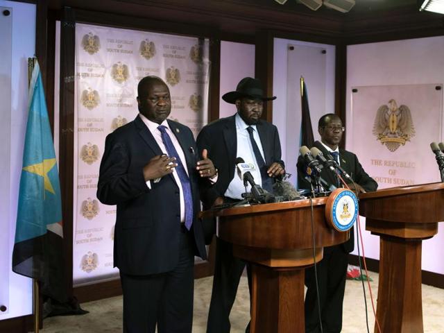First Vice President Riek Machar (L) delivers a speech to journalists next to South Sudan President Salva Kiir (C) and Vice President James Wani Igga (R) prior to the shooting outside the presidential palace in Juba on July 8, 2016. (AFP Photo) First Vice President Riek Machar (L) delivers a speech to journalists next to South Sudan President Salva Kiir (C) and Vice President James Wani Igga (R) prior to the shooting outside the presidential palace in Juba on July 8, 2016. (AFP Photo)