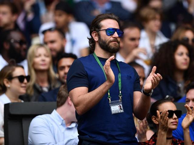 US actor Bradley Cooper applauds as Canada's Milos Raonic plays Switzerland's Roger Federer. (AFP Photo) 