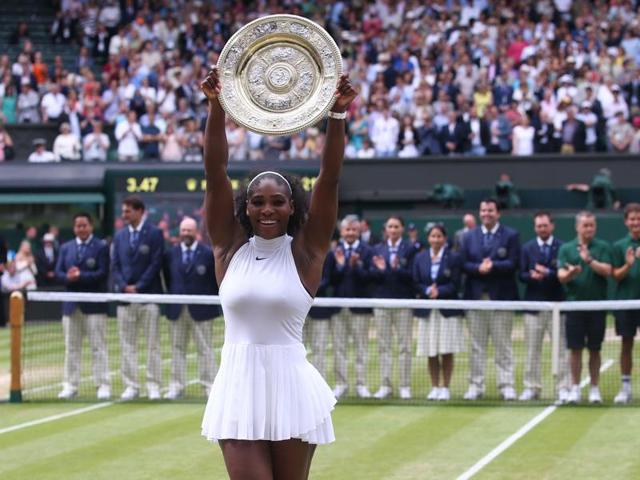 Serena poses with the Venus Rosewater Dish. (AFP) Serena poses with the Venus Rosewater Dish. (AFP)