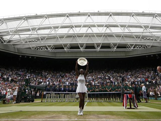 Serena celebrates with the trophy. (REUTERS) Serena celebrates with the trophy. (REUTERS)