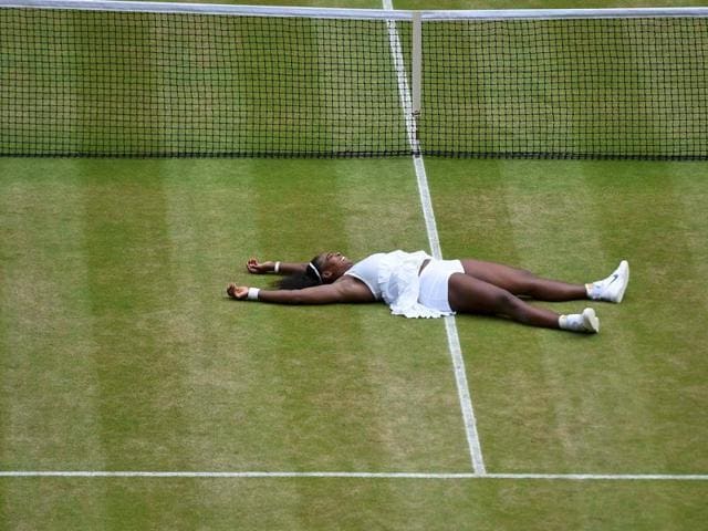 Serena falls to the grass in celebration of her win. (REUTERS) Serena falls to the grass in celebration of her win. (REUTERS)