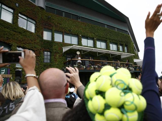 Serena poses with the trophy on the balcony outside Centre Court. (REUTERS) Serena poses with the trophy on the balcony outside Centre Court. (REUTERS)