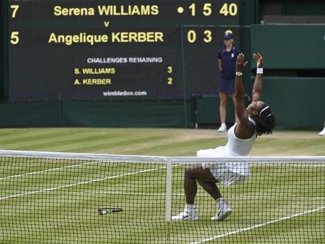 Serena lets go of her racquet and falls on the grass of Centre Court after her win. (Reuters) Serena lets go of her racquet and falls on the grass of Centre Court after her win. (Reuters)