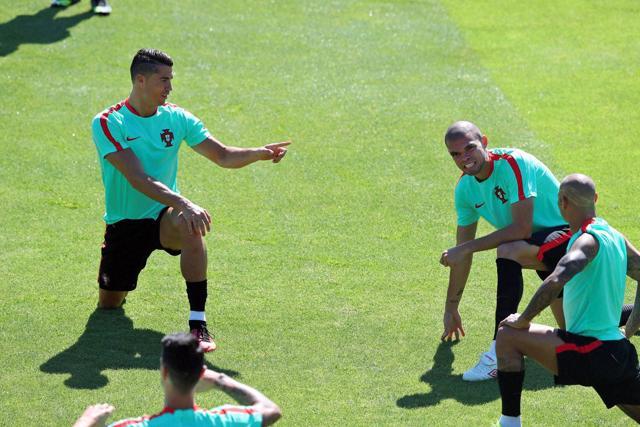 Portugal's Christiano Ronaldo Ricardo Quaresma and Pepe stretch during a training session in Marcoussis. (AP)