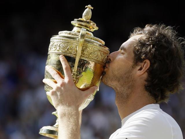 Andy Murray of Britain kisses his trophy after beating Milos Raonic of Canada in the men's singles final on day fourteen of the Wimbledon Tennis Championships in London. (AP Photo) Andy Murray of Britain kisses his trophy after beating Milos Raonic of Canada in the men's singles final on day fourteen of the Wimbledon Tennis Championships in London. (AP Photo)