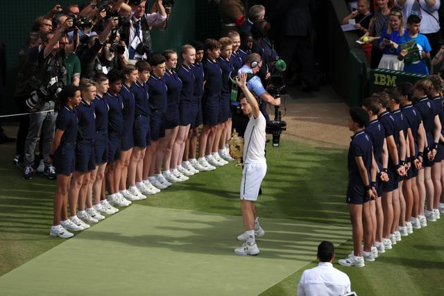 Andy Murray holds his trophy after beating Milos Raonic in the men's singles final. (AP Photo) Andy Murray holds his trophy after beating Milos Raonic in the men's singles final. (AP Photo)