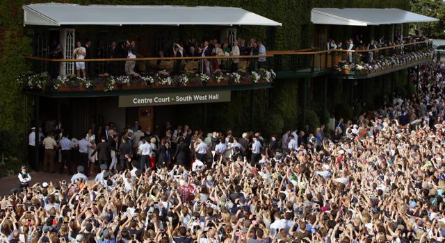 Andy Murray (top left) holds up the trophy after winning the Wimbledon men’ singles. (AP Photo) Andy Murray (top left) holds up the trophy after winning the Wimbledon men’ singles. (AP Photo)