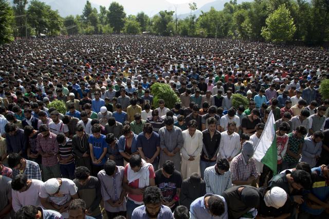 Kashmiri villagers pray during the funeral of Burhan Wani, chief of operations of Indian Kashmir's largest rebel group Hizbul Mujahideen, in Tral. (AP)
